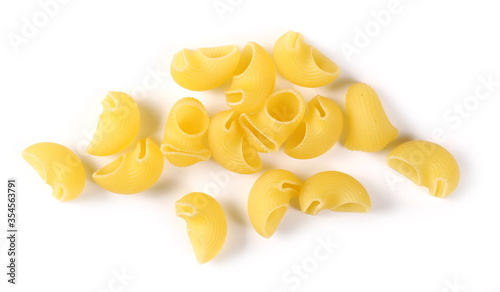 Pasta lumaconi rigati pile isolated on white background, top view