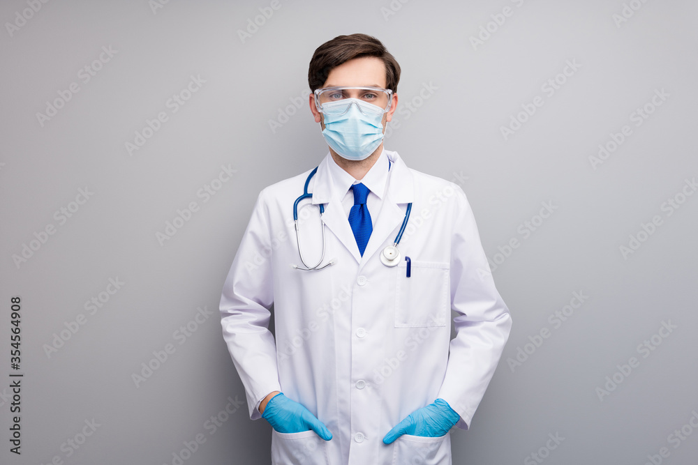 Photo of attractive handsome serious doc guy professional surgeon specialist good mood listen patient wear facial protective mask uniform white coat tie stethoscope isolated grey background Photo of attractive handsome serious doc guy professional surgeon specialist good mood listen patient wear facial protective mask uniform white coat tie stethoscope isolated grey background