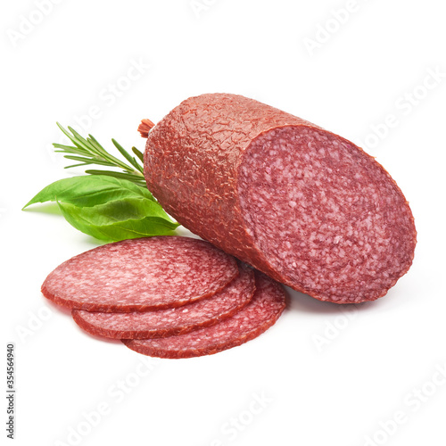 Dried Salami Sausage with basil, close-up, isolated on a white background