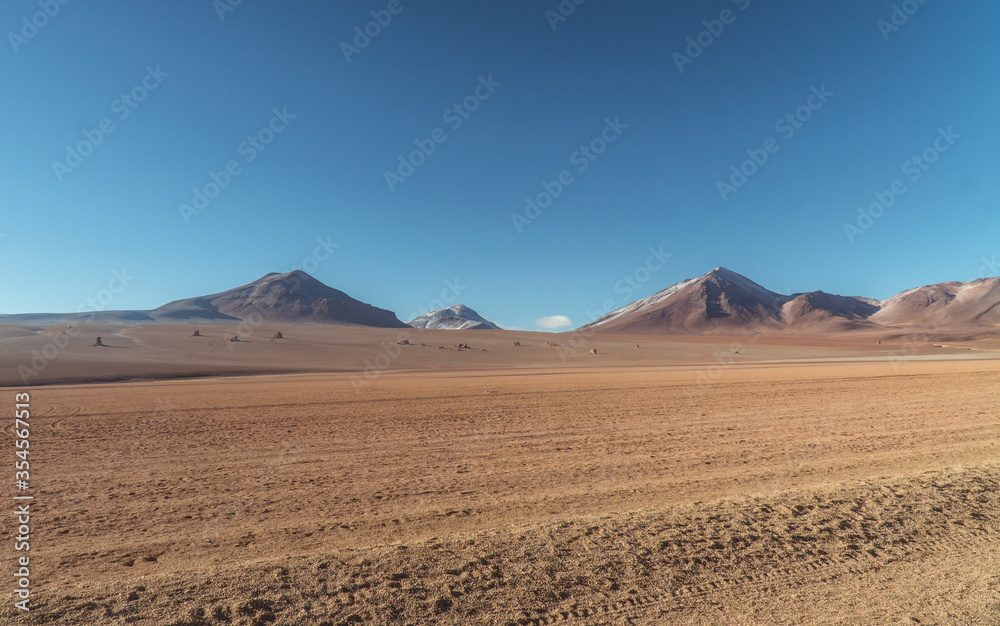 Landscape mountain Water Lake. Dry, Barren desert, snowcapped mountains wilderness. Mountain range view. Salt Flats, Uyuni, Bolivia. Copy space, Rocks, blue sky, nature, hiker, hiking Landscape mountain Water Lake. Dry, Barren desert, snowcapped mountains wilderness. Mountain range view. Salt Flats, Uyuni, Bolivia. Copy space, Rocks, blue sky, nature, hiker, hiking