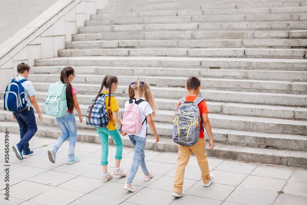 Teenagers with backpacks.