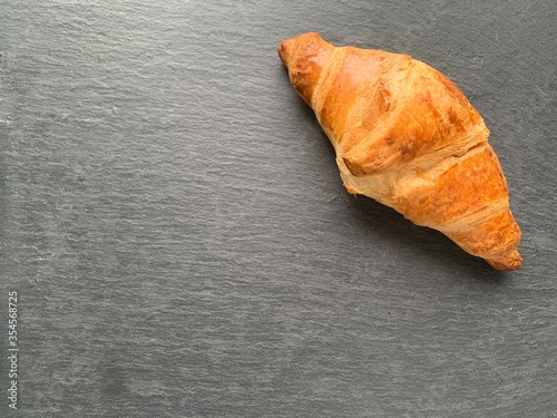 Croissant on a wooden table