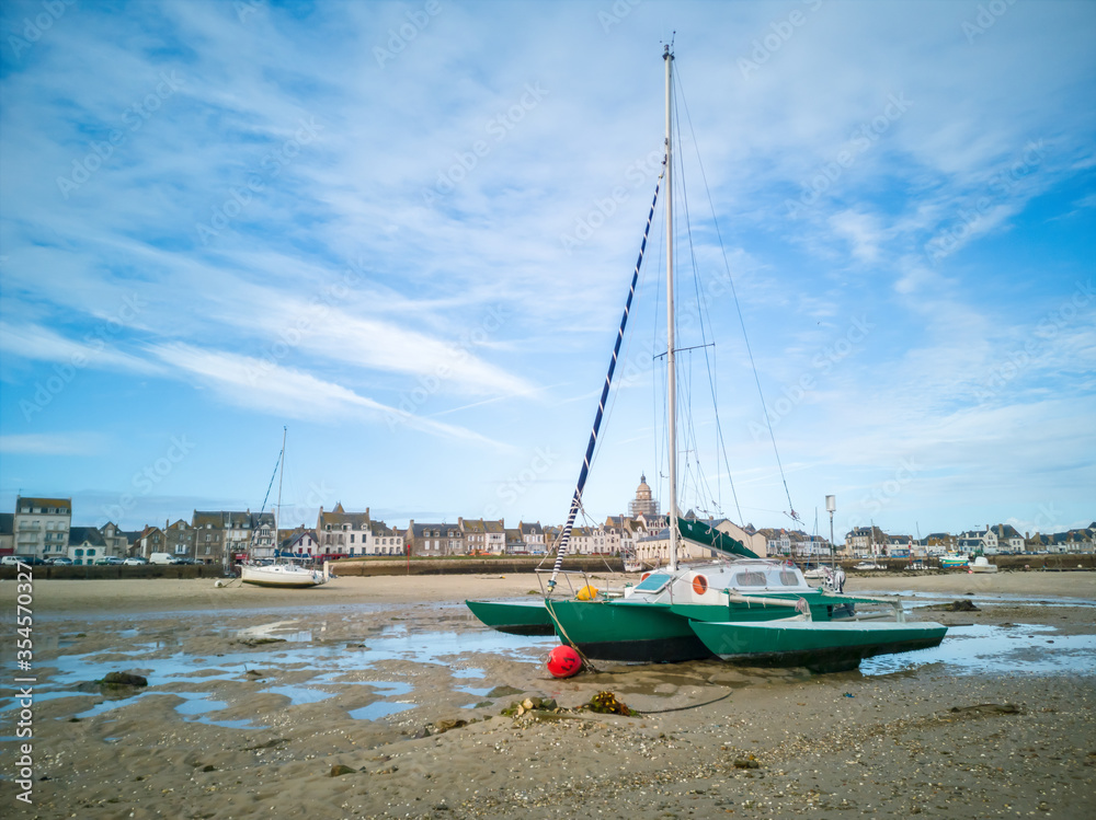 Sailboat on the sand at low tide, village of the Croisic on Guerande peninsula, France Sailboat on the sand at low tide, village of the Croisic on Guerande peninsula, France
