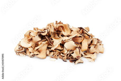 Edible dried mushrooms pile on white background isolated close up, heap of dry boletus edulis, chopped brown cap boletus, sliced penny bun, pieces of cep, porcino or porcini, cutted white fungus 