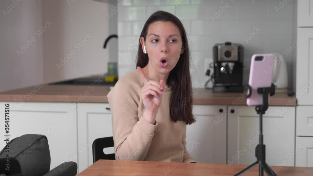 Young caucasian woman dancing in phone camera live stream. social media dancing challenge. Young caucasian woman dancing in phone camera live stream. social media dancing challenge.