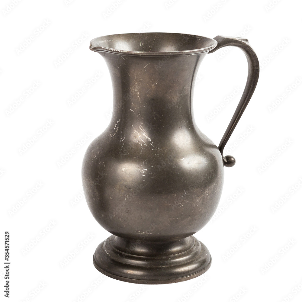 Vintage carved iron jug on a white background