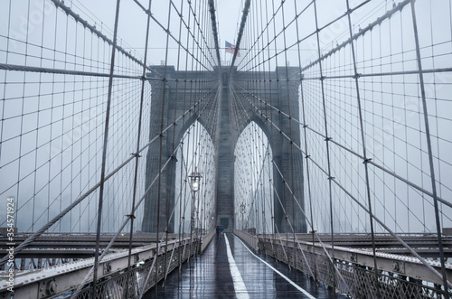Brooklyn bridge, New York City. USA. New York in a foggy day in downtown Manhattan. © Elena Titova