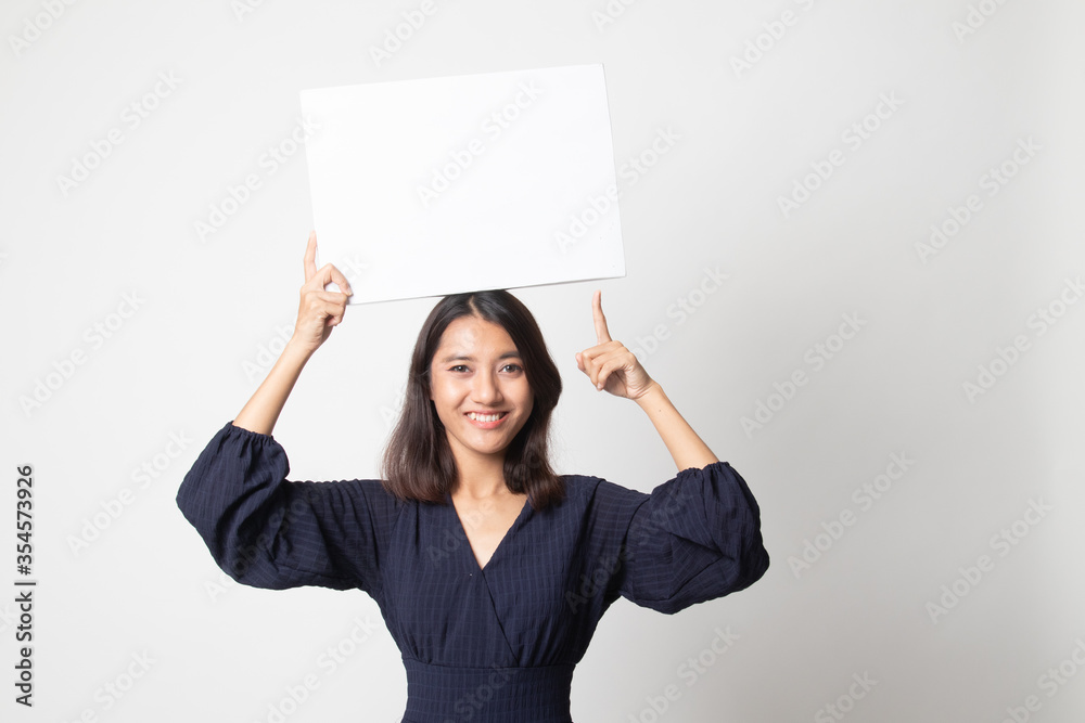 Young Asian woman point to blank sign.