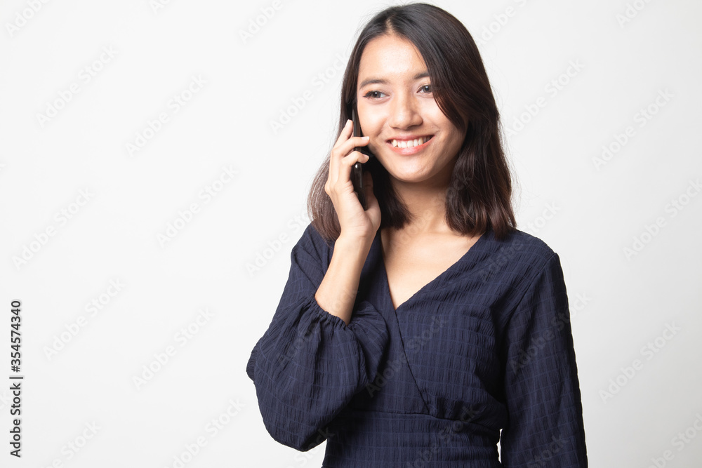 Young Asian woman talking with mobile phone. Young Asian woman talking with mobile phone.