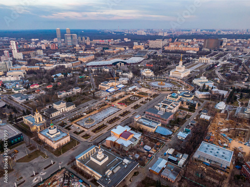 Large city park VDNH in Moscow from above without people, in the frame idle fountains and empty streets. Aerial photography