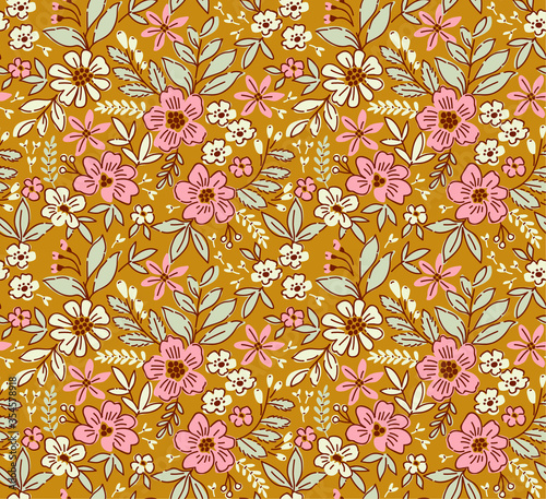 Floral pattern. Pretty flowers on gold  background. Printing with small  flowers. Ditsy print. Seamless vector texture. Spring bouquet.