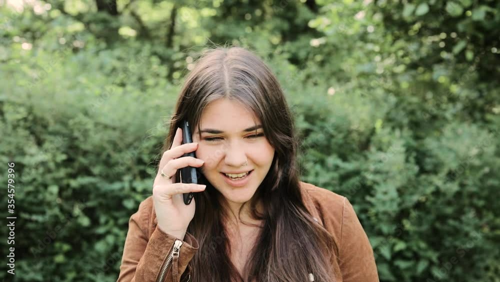 Angry young woman arguing talking on phone having problem of conflict during telephone conversation, shouting gesturing. Angry young woman arguing talking on phone having problem of conflict during telephone conversation, shouting gesturing.