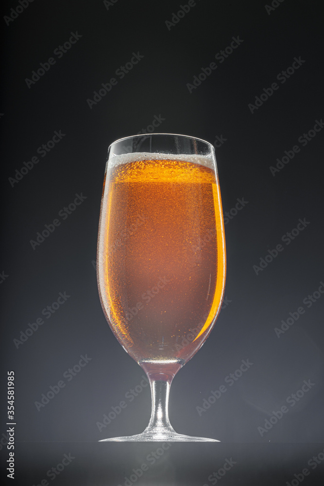 Glass of beer on black background, copy space Glass of beer on black background, copy space