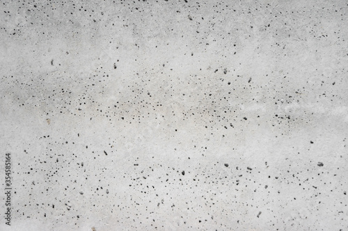 Texture of  gray concrete wall for background. concrete slab with holes from air bubbles