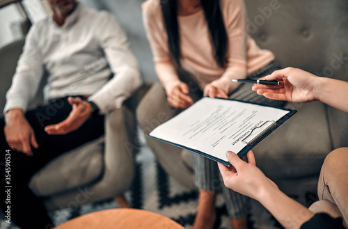 Couple signing divorce agreement photo