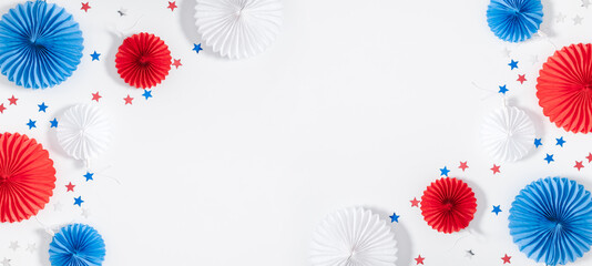 4th of July American Independence Day. Happy Independence Day. Red, blue and white star confetti, paper decorations on white background. Flat lay, top view, copy space, banner