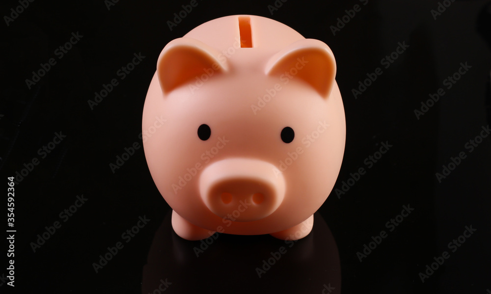 Piggy bank isolated on black background Piggy bank isolated on black background