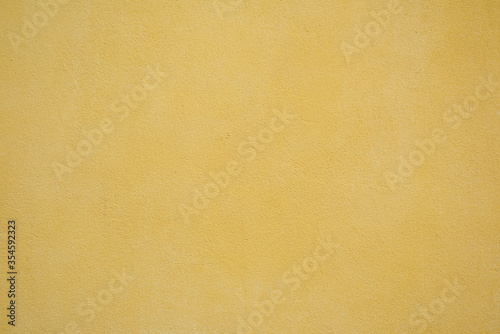 fragment of a yellow wall from cement