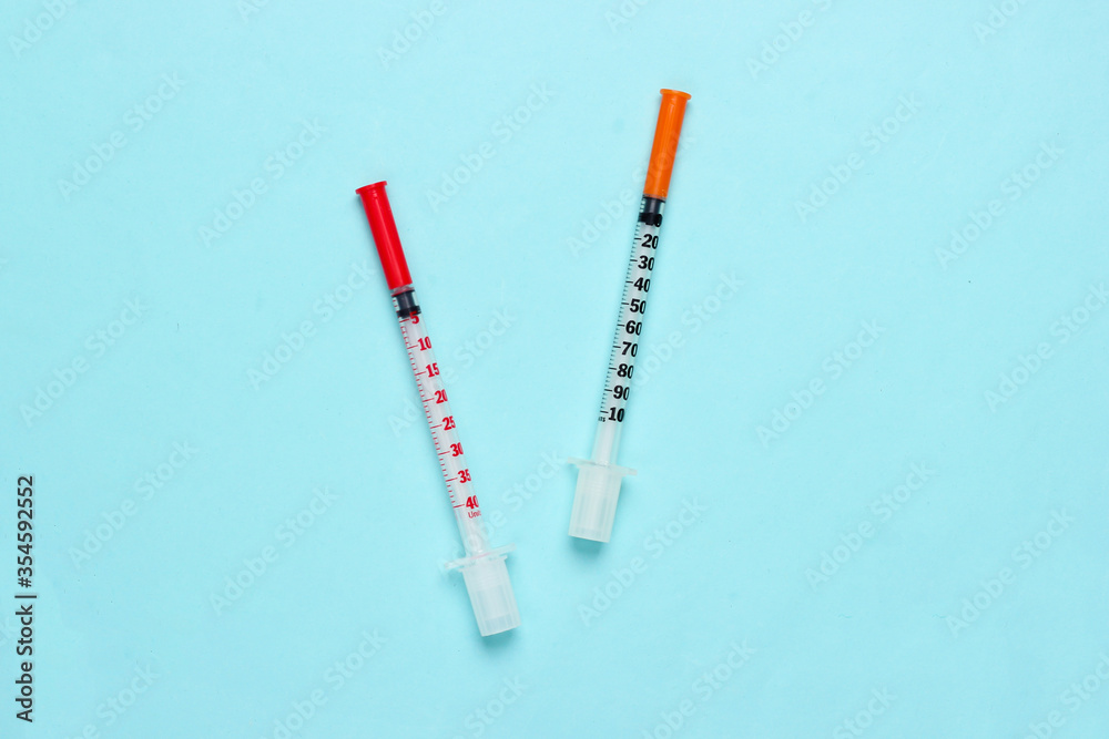 Two syringes on a black background. Vaccination. Top view Two syringes on a black background. Vaccination. Top view