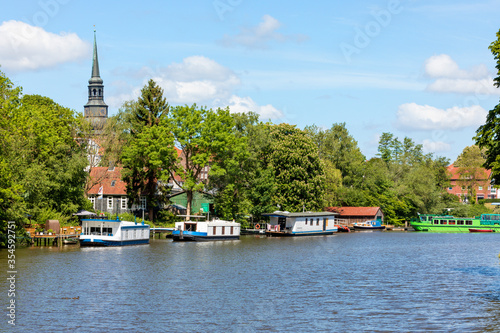 Burggraben at Stade with houseboats and belltower of St Cosmae church in background