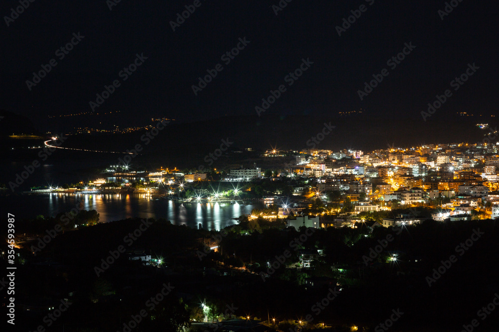 Aerial view of night town from Hill after sunset - modern city with spectacular nightscape panorama. aerial view, night city with night sky. natural summer night. horizontal