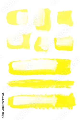 Abstract yellow color painting on a white background. Bright spots of paint, stains in acrylic. Aspen Gold color