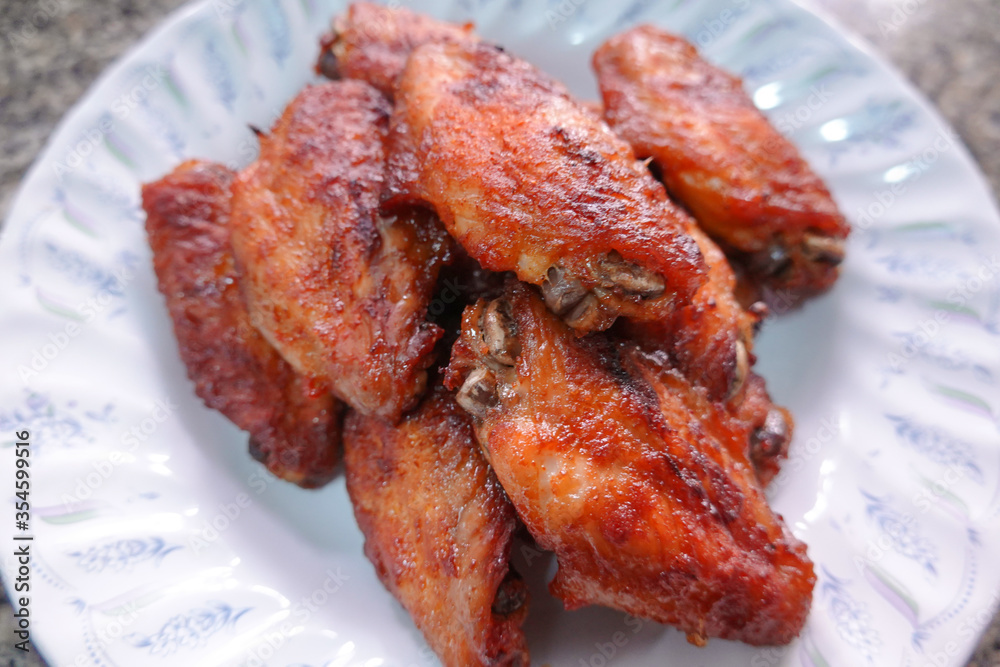 traditional Thai culture fried chicken wing grilled cuisine air fryer or kai tod yang box set famous street fast foods menu at thailand hot spicy sauces on wood sticky rice traditional Thai culture fried chicken wing grilled cuisine air fryer or kai tod yang box set famous street fast foods menu at thailand hot spicy sauces on wood sticky rice