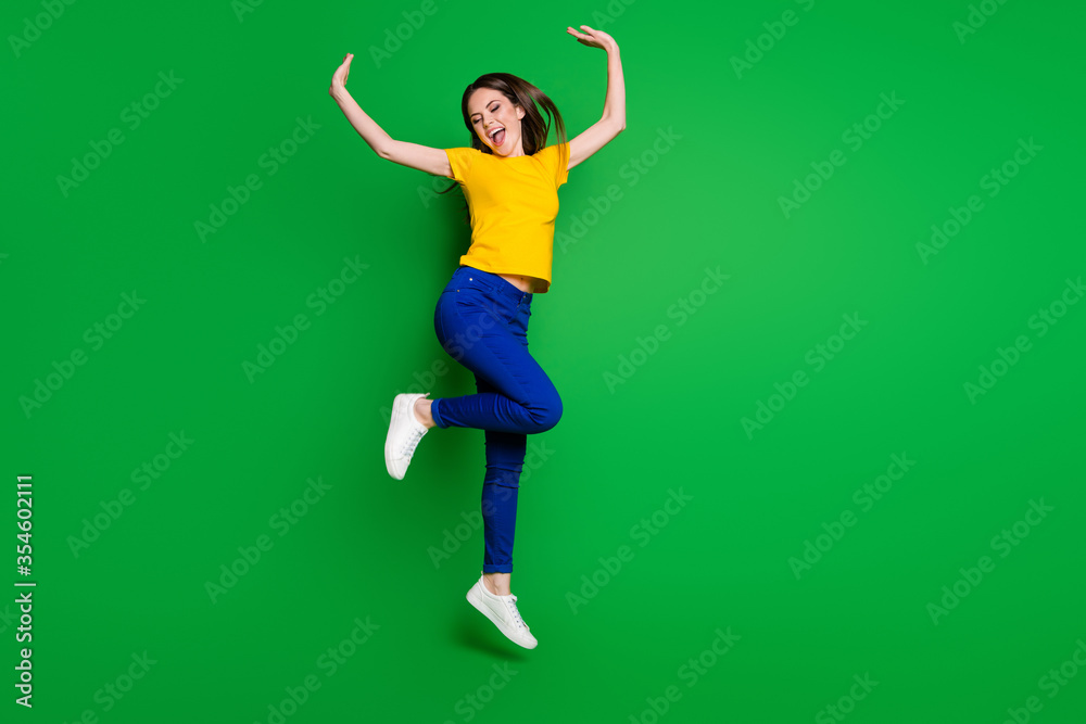Full length body size view of her she nice attractive lovely dreamy glad careless cheerful cheery girl jumping dancing having fun isolated bright vivid shine vibrant green color background