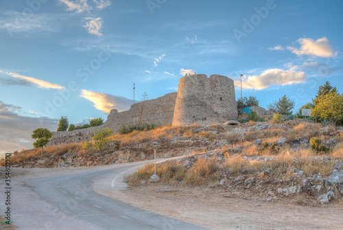 Sunset view of Lekuresi castle at Sarande, Albania photo