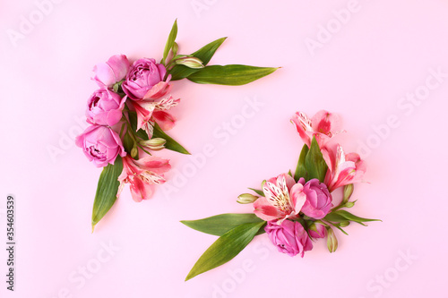 Rose buds frame on pink background.