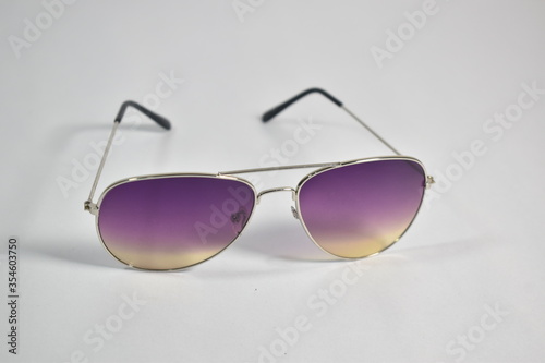 Close up of Two shaded sun glasses on white background 