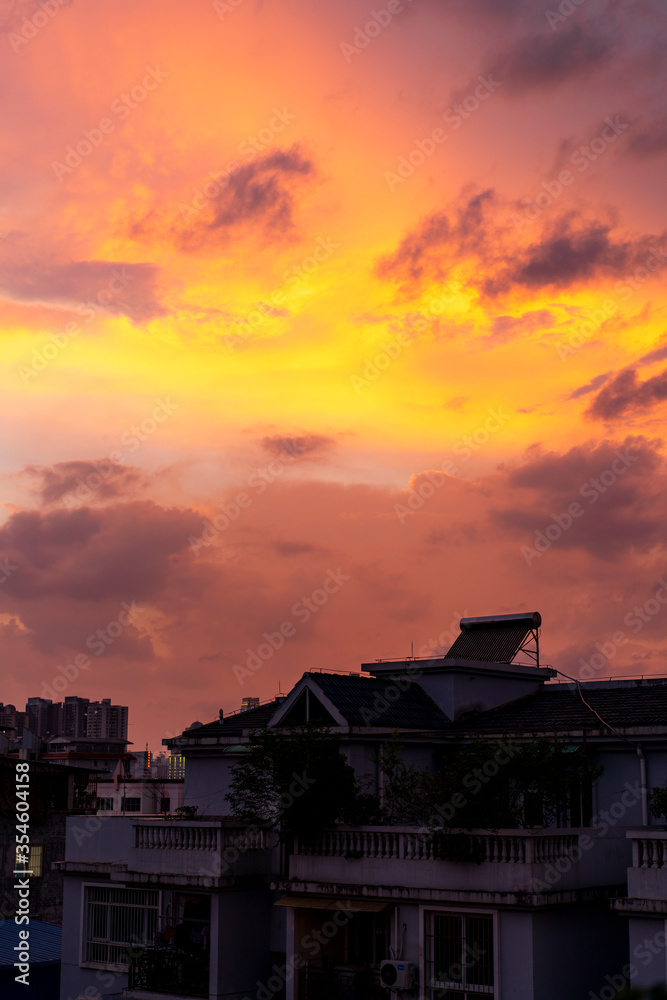 Evening city sky sunset burning clouds Evening city sky sunset burning clouds