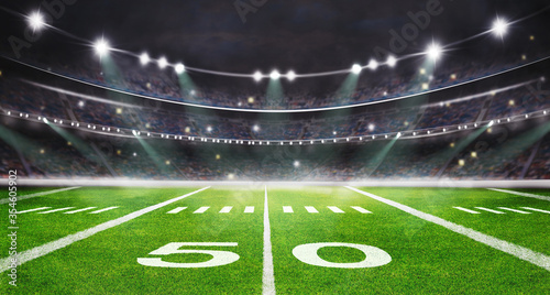 green field in american football stadium. ready for game in the midfield
