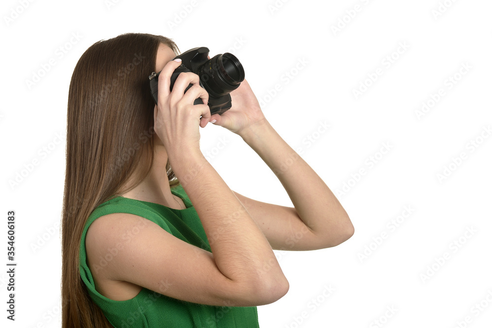 Young beautiful caucasian woman with camera over white background