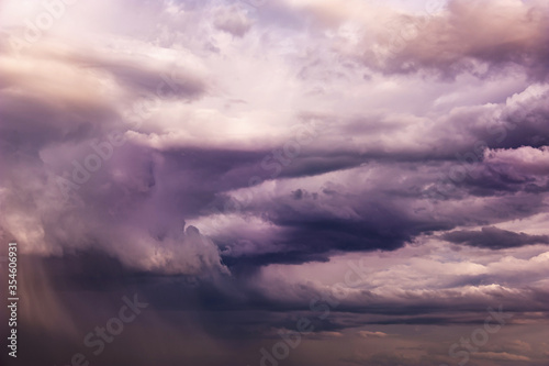 Natural sky composition. Dark ominous colorful storm rain clouds. Dramatic sky. Overcast stormy cloudscape. Thunderstorm. Element of apocalypse design.