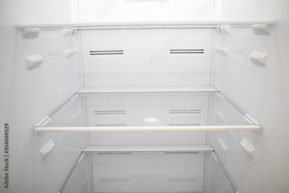 Close-up of Empty Refrigerator inside. Empty fridge shelves Close-up of Empty Refrigerator inside. Empty fridge shelves