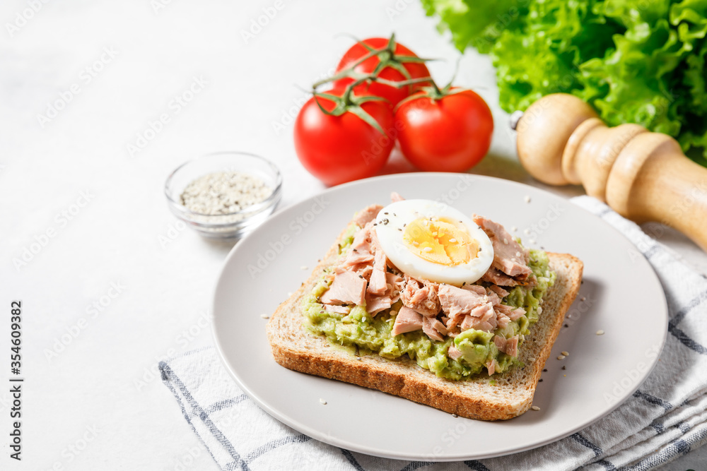 Avocado toast with tuna and boiled egg.
