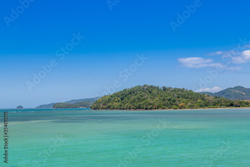 scenic view of island found in Ambong, Tuaran district with blue sky in the background