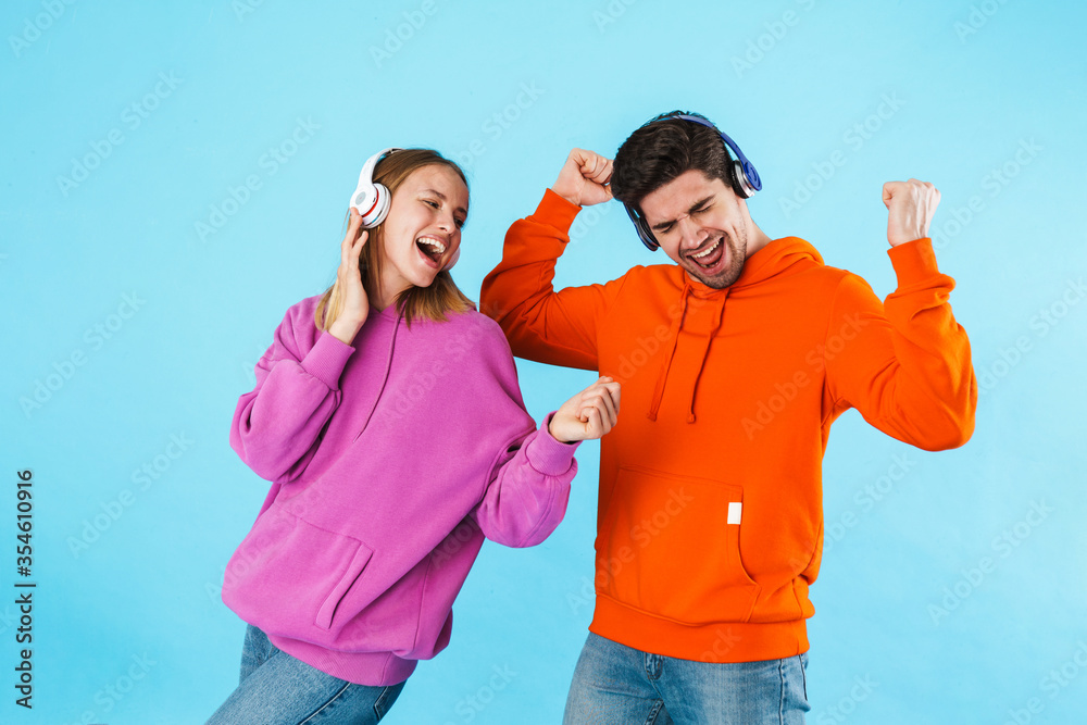 Portrait of a young couple wearing hoodies Portrait of a young couple wearing hoodies
