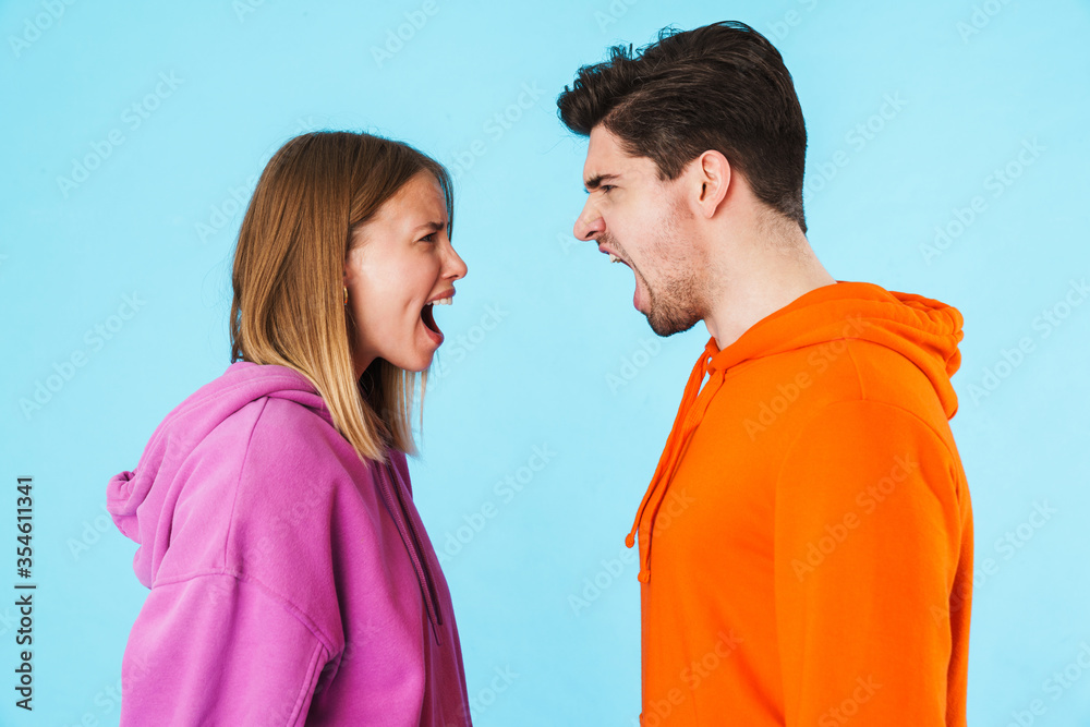 Fototapeta premium Portrait of a young couple wearing hoodies