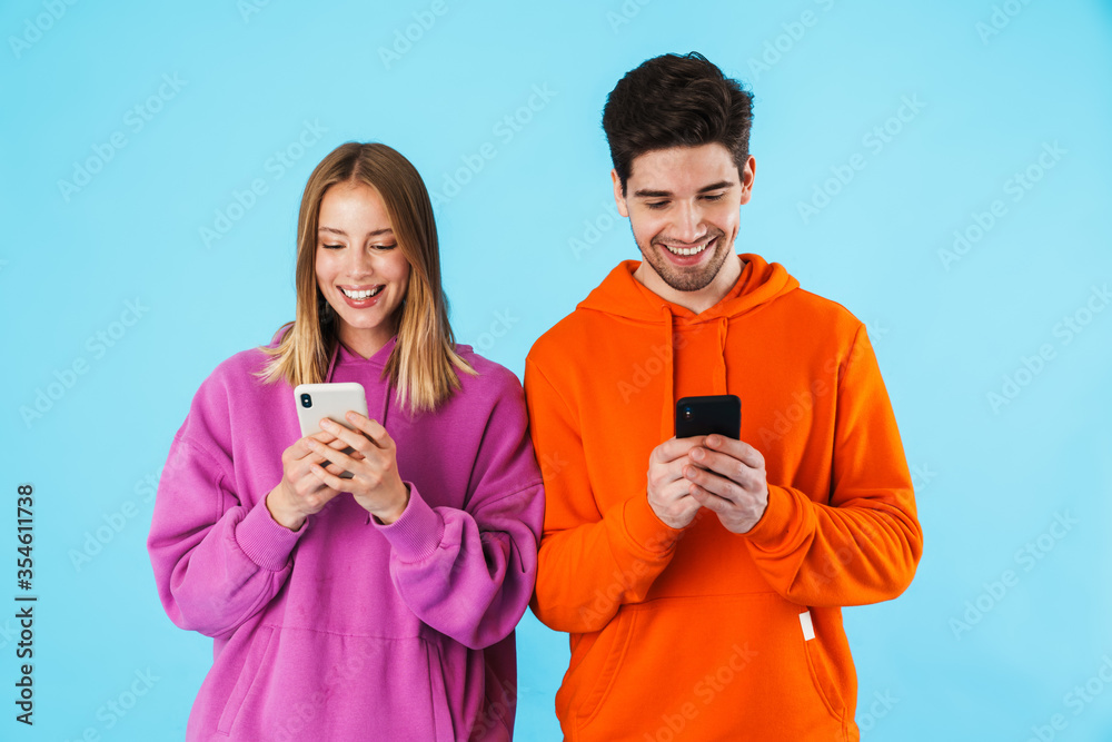 Portrait of a young couple wearing hoodies Portrait of a young couple wearing hoodies