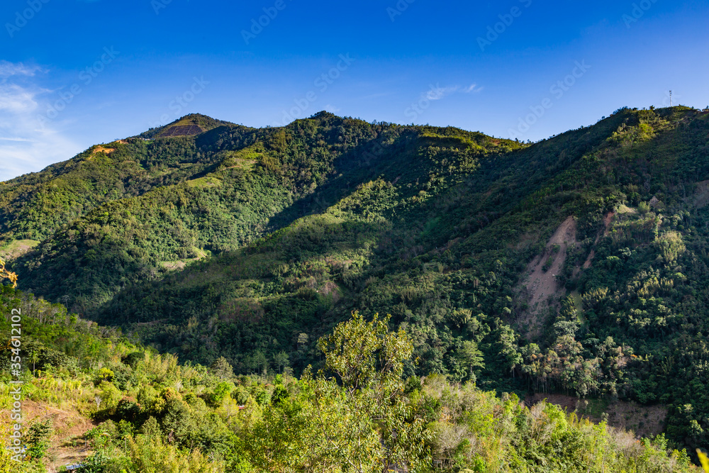 the serene view of hills in the valley of Kampung Kiau, Bundu Tuhan