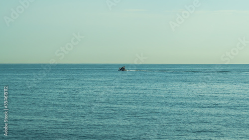  motor boat racing on the blue sea © Vladzimir