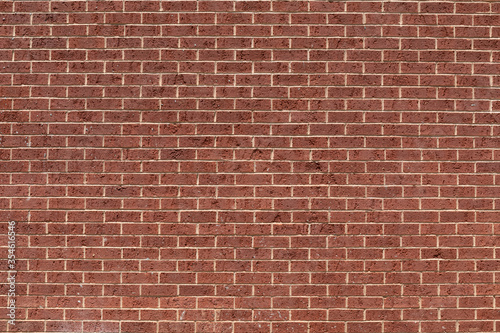 Wide view of classic red brick wall, running bond pattern, creative copy space, horizontal aspect