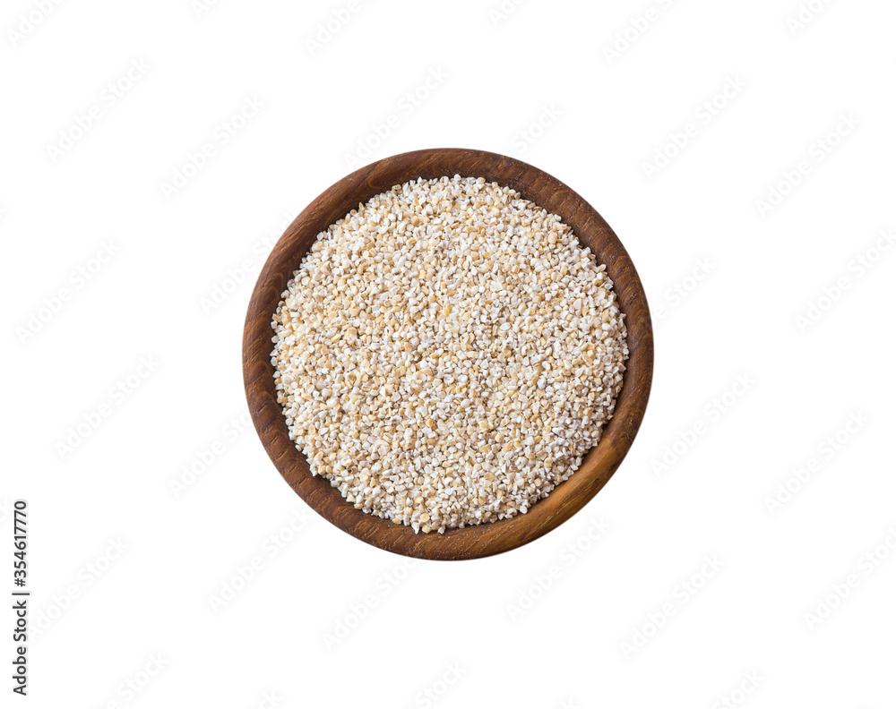 Barley groats on a white background top view. Raw crushed barley grains for making porridge. Heap of barley grits isolated on white. Top view, Image with copy space. Barley groats on a white background top view. Raw crushed barley grains for making porridge. Heap of barley grits isolated on white. Top view, Image with copy space.