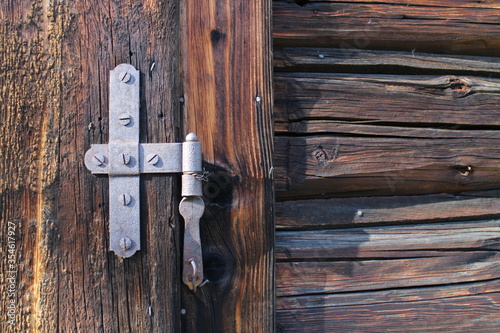 Door hinge on Log cabin in Nizna Boca village and municipality in Liptovsky Mikulas district, central Slovakia photo