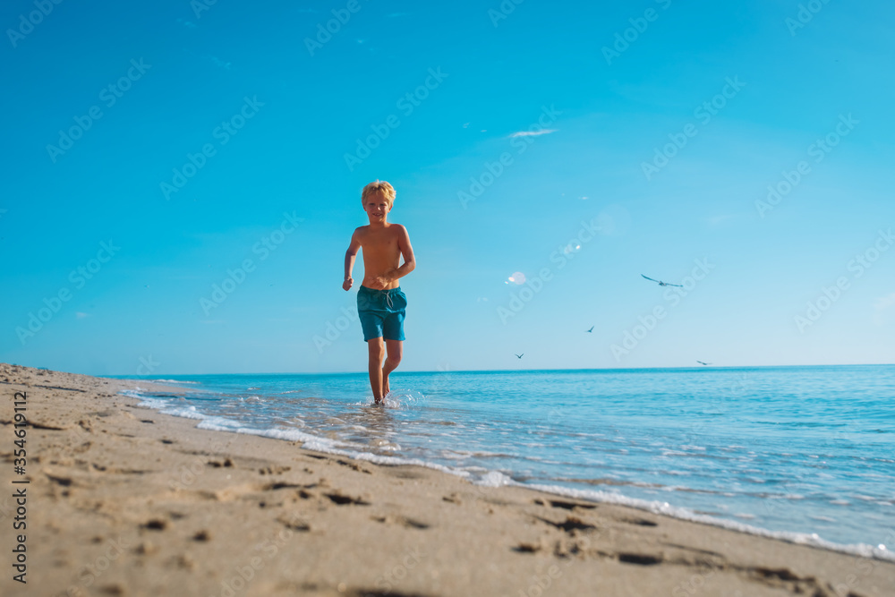 kid run at beach, child exercise, healthy lifestyle concept