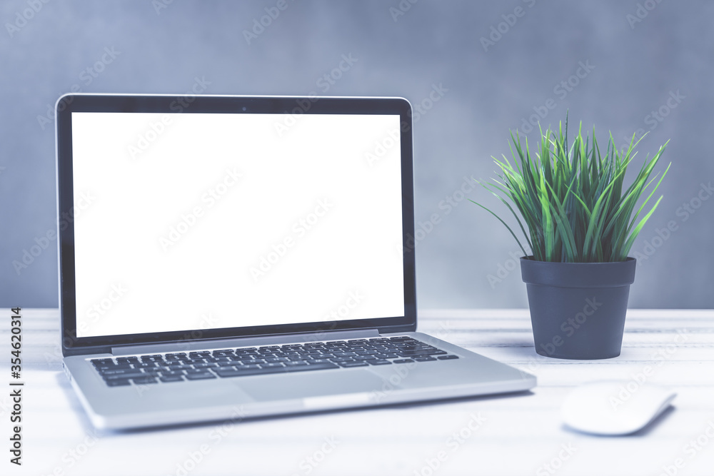 © velishchuk - Laptop computer white blank screen on work table front view. Copy space, home and office workspace concept, laptop mockup. © velishchuk - Laptop computer white blank screen on work table front view. Copy space, home and office workspace concept, laptop mockup.
