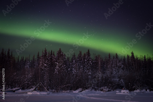 The Aurora Borealis dances over Jolliffe Island as photographed from on a frozen Great Slave Lake in Yellowknife, Northwest Territories, Canada.
