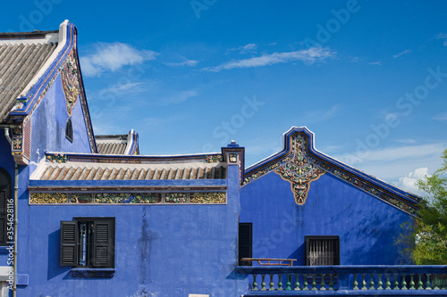 blue wall with decorations of broken pieces of porcelain on The Blue Mansion in George Town, Penang,  Malaysia photo